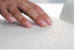 fingers reading braille