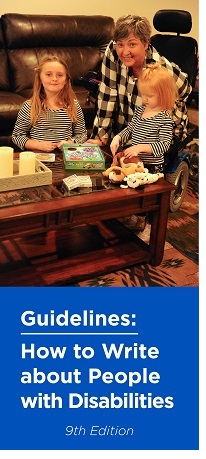 the cover of the guidelines: a wheelchair user and her grandchildren stop playing in her living room to pose for the camera
