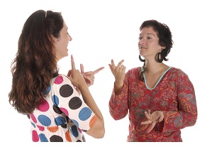 two women using sign language